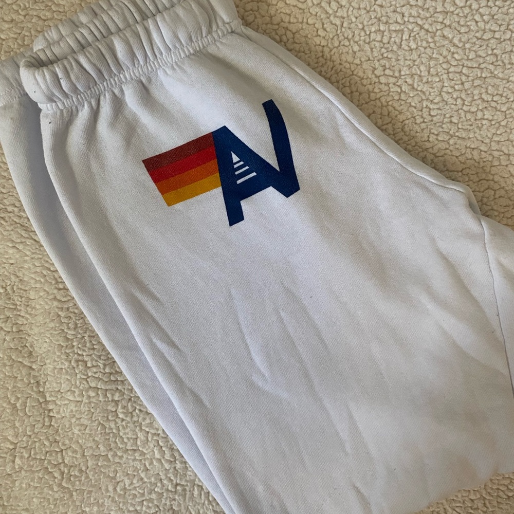 Aviator Nation White Joggers with Blue Logo and Rainbow Stripe